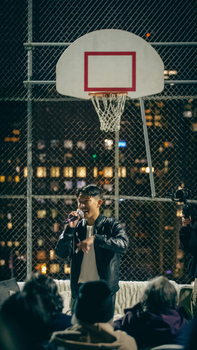 son of paper performing in front of a crowd